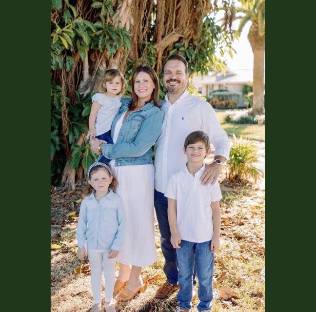 Chris and Allie Lopez with their three children under a banyan tree in Whiskey Creek